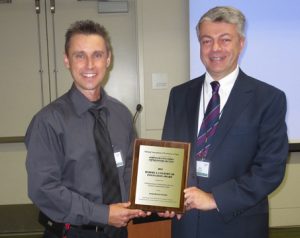 Kenneth A. Hansen (right) director Utah Division of Administrative Rules accepts the 2013 Colborn Award from ACR President Scott Cancelosi